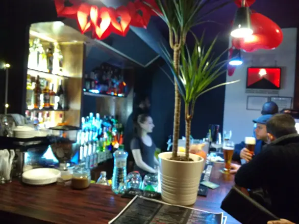 The bar under red lamps
