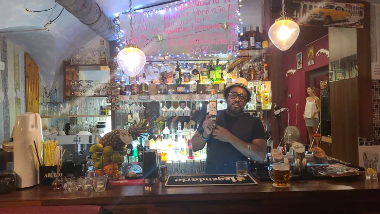 The whole bar, bartender at work